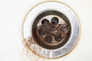 Hair is one of the leading causes of clogged bathroom drains